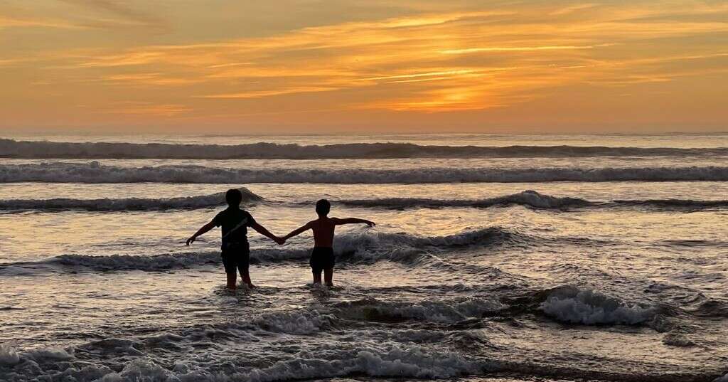 Family beach time at sunset in Portugal